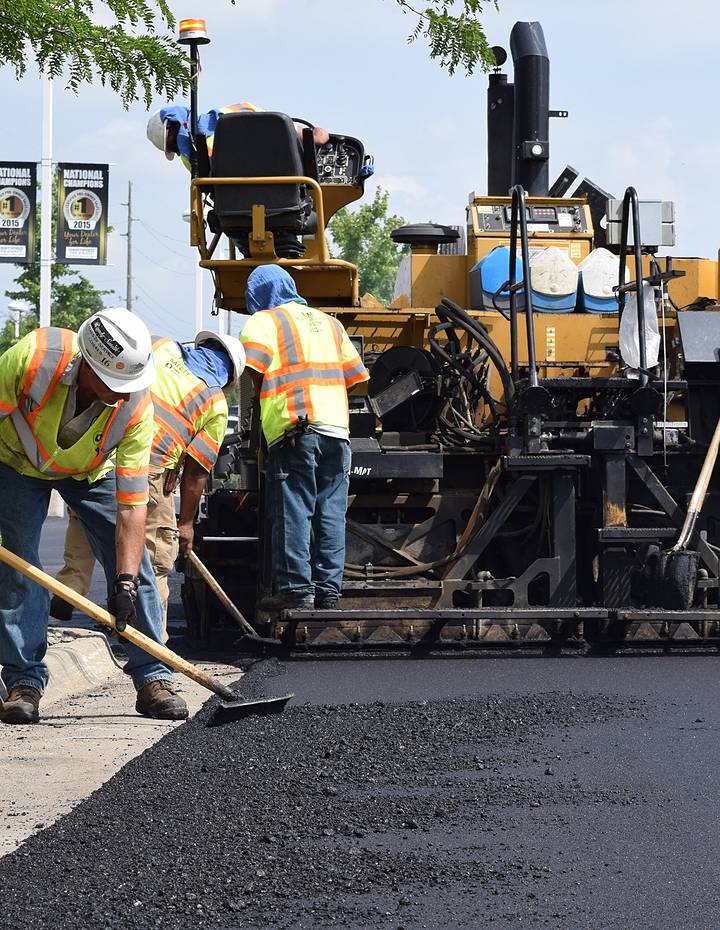 team flattening asphalt in des moines