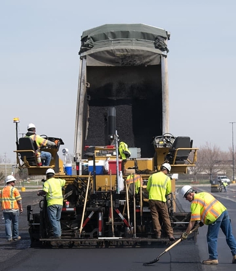 workers paving highway