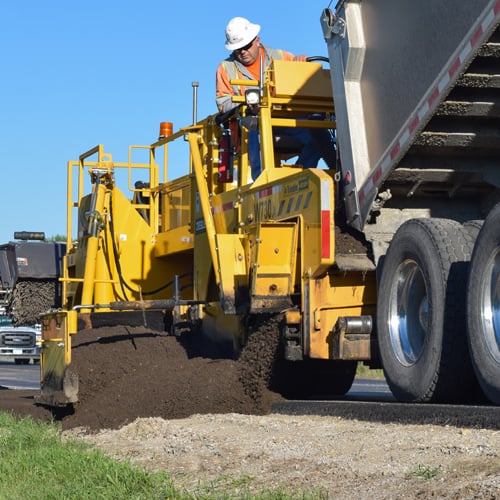 workers laying paving materials